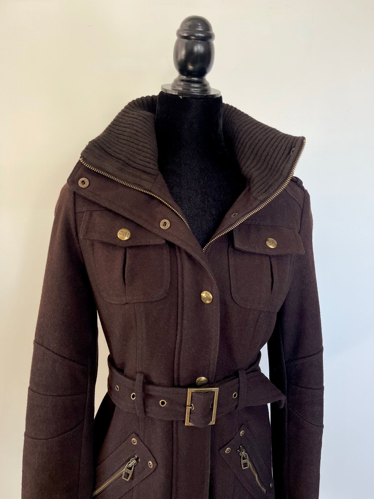Brown vintage Y2K Miss Sixty Hooded coat with a belt on a mannequin against a plain background