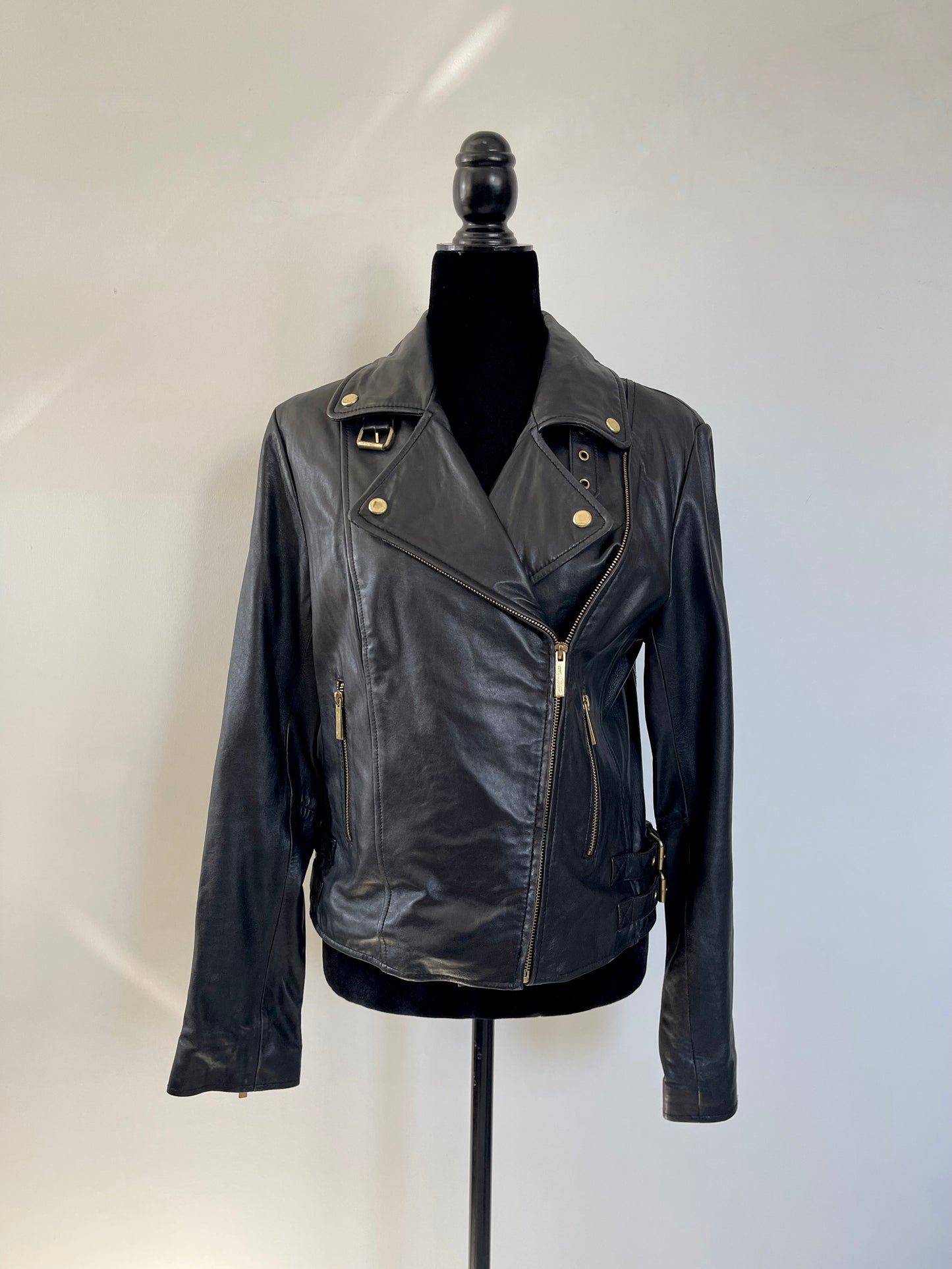 Black Vintage Y2K Victoria's Secret Leather Motorcycle Jacket on a mannequin against a white background